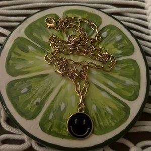 super cute gold and black smiley necklace